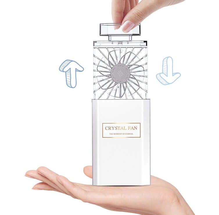 DROPPZZA perfume fan demonstrated in hand with adjustable design showcasing the fan blades.
