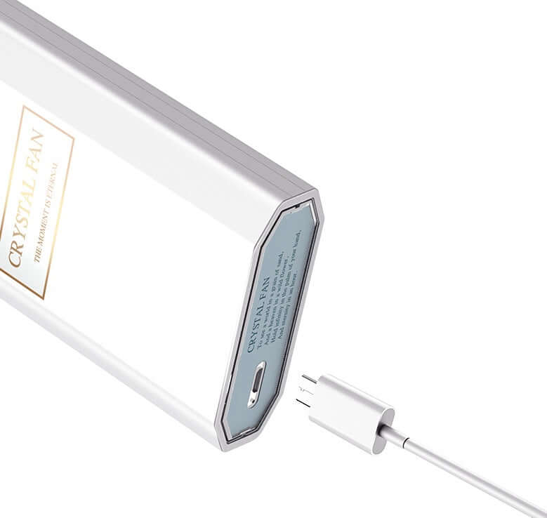 DROPPZZA perfume fan with charging cable and sleek design, ideal for fragrance misting on the go